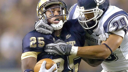 LeSean McCoy, trying to fight off Connecticut's Tyvon Branch in the first quarter Saturday night, doesn't mind sharing Pitt's running-back job with LaRod Stephens-Howling.