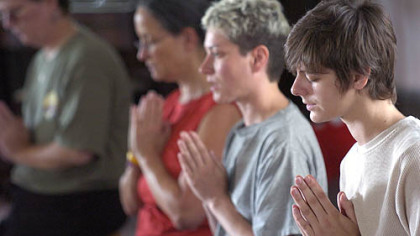 Rebecca Droke/Post-Gazette
Liz Snyder, right, and Shawn Curry, center, both of Dormont, and Julie Ann Sullivan pray during the Mountain Wind Zen Meditation retreat Saturday at the Unitarian Universalist Church of the South Hills.