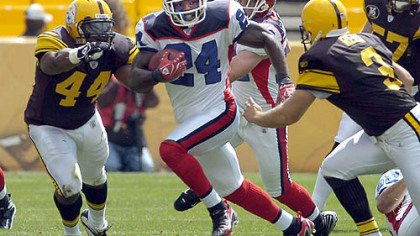 Steelers runningback Najeh Davenport and kicker Jeff Reed go for the tackle on Bills Terrence McGee on a kickoff return.
