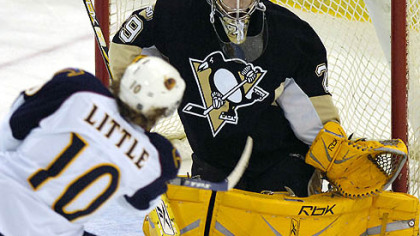 Goaltender Marc-Andre Fleury makes a save on a shot by the Thrashers' Bryan Little in a game Nov. 24. Fleury has had two consecutive strong starts for the Penguins.