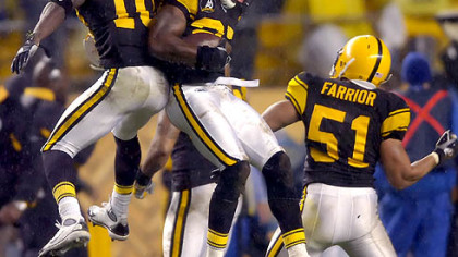 Wide receiver Santonio Holmes and linebacker James Farrior celebrate with teammate defensive back Anthony Smith after he recovered a fumble in the second quarter.(vs. Ravens 11/05/07)