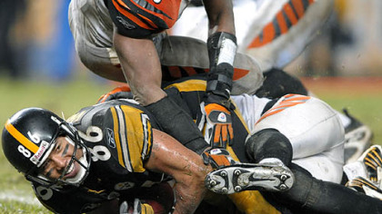 Hines Ward smiles as he crosses the goal line after scoring his second touchdown in the third quarter, breaking John Stallworth's team record of 63 career touchdown catches. (vs. Bengals 12/02/2007)