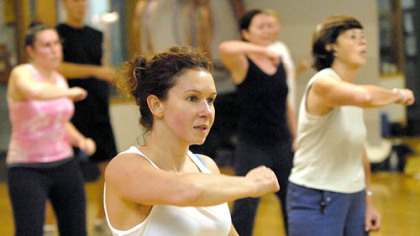 Anna Uskova, center, works out at Maria McCalister's Zumba aerobics exercise class at Club 1. An anesthesiologist at UPMC Shadyside, Dr. Uskova also lifts weights and takes yoga.