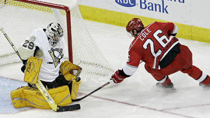 
Goalie Marc-Andre Fleury blocks a shot by the Carolina Hurricanes' Erik Cole in the second period of the Penguins' season opener last night.